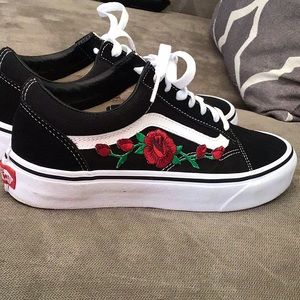 Vans with rose design on the side.